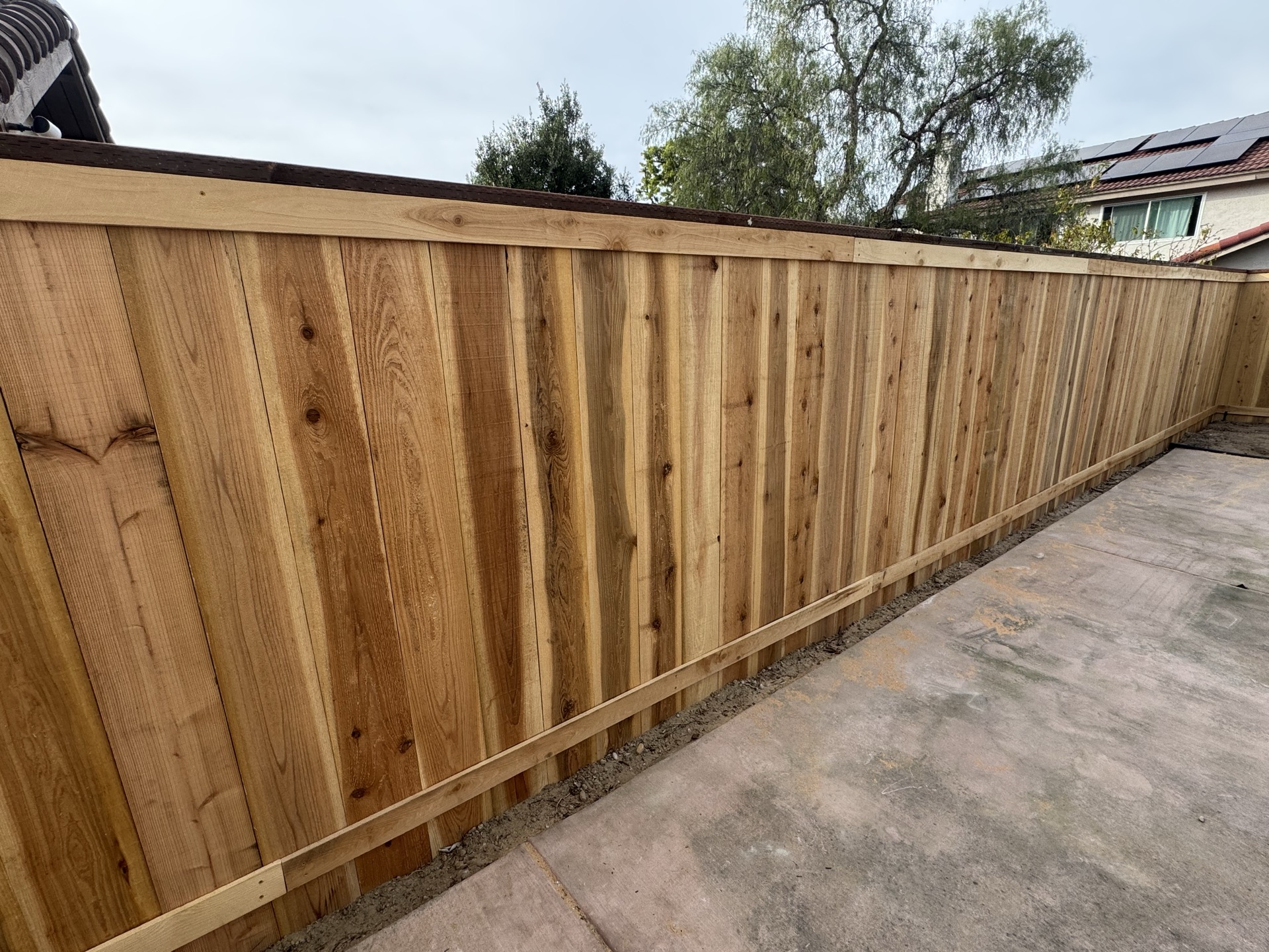 Cedar board-on-board privacy fence installation