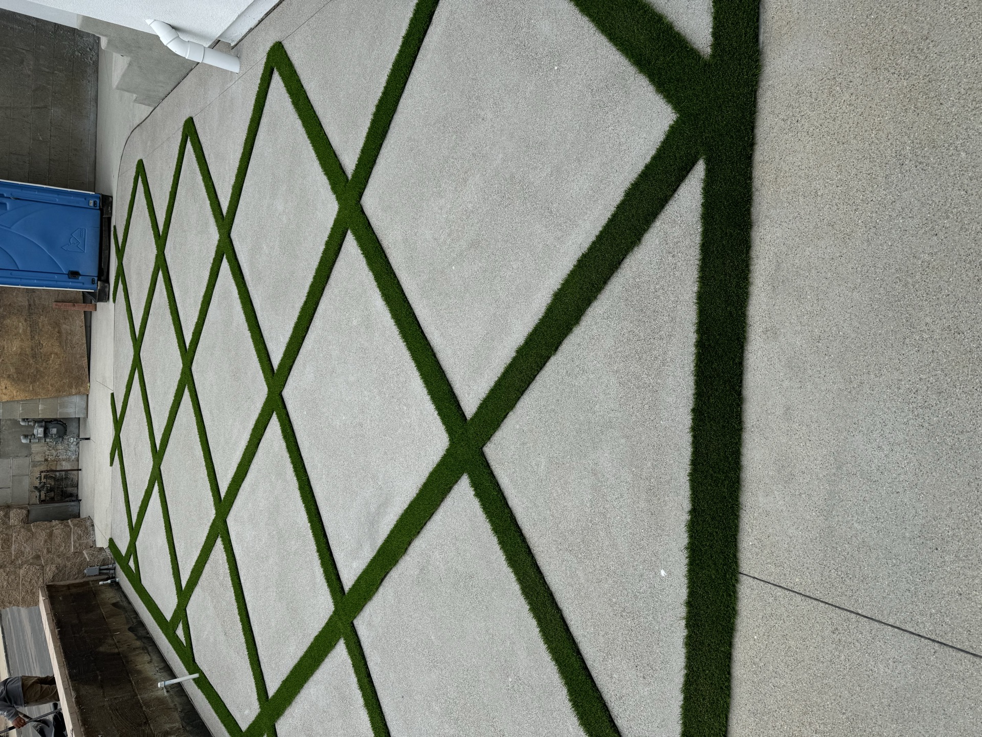 Diamond pattern concrete with turf inlay in San Diego