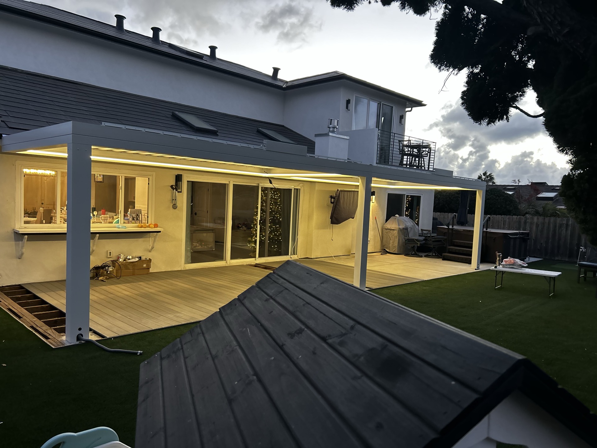 Pergola and patio illuminated with LED lighting in the evening