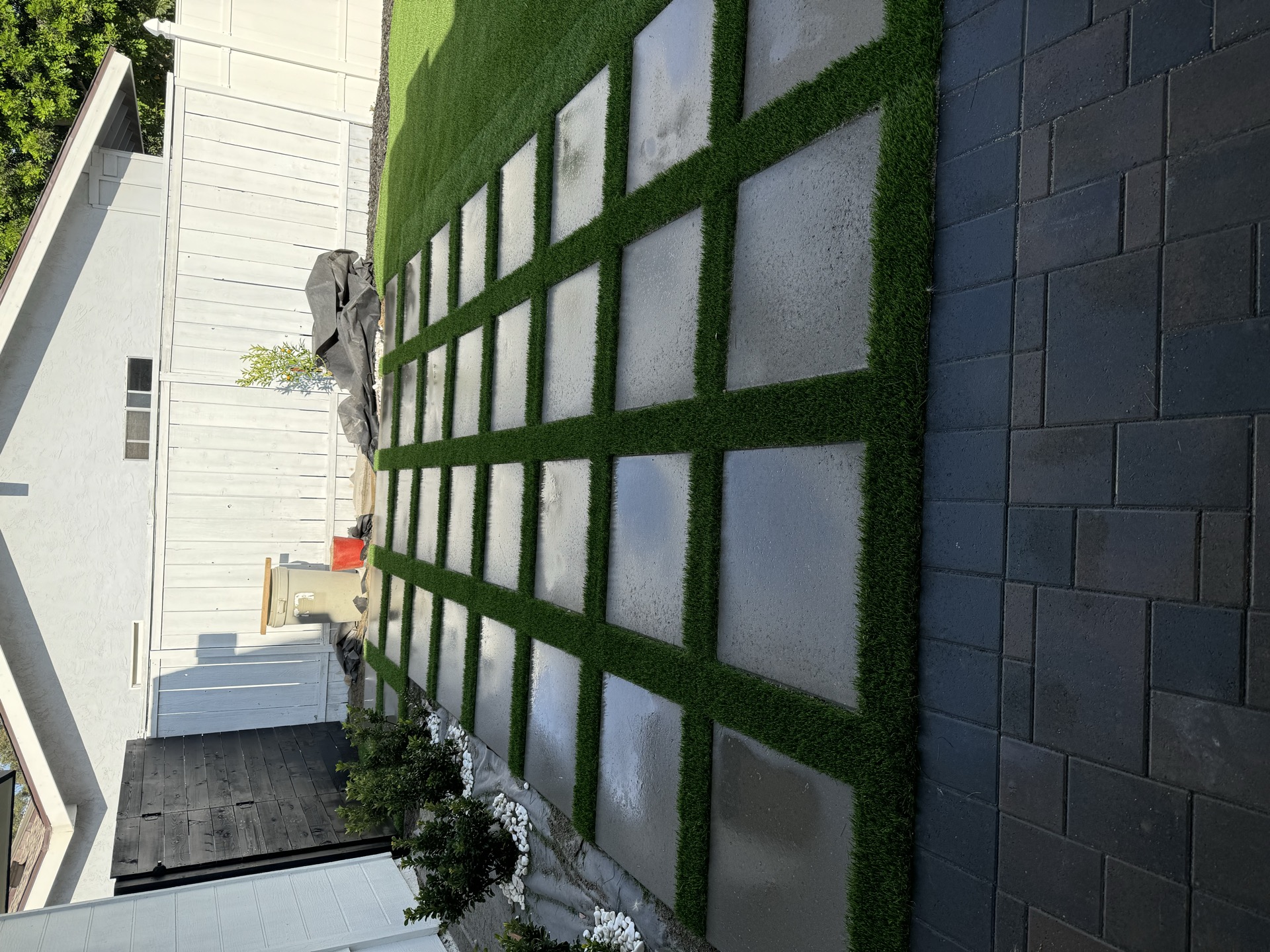 Modern paver patio with turf strips San Diego