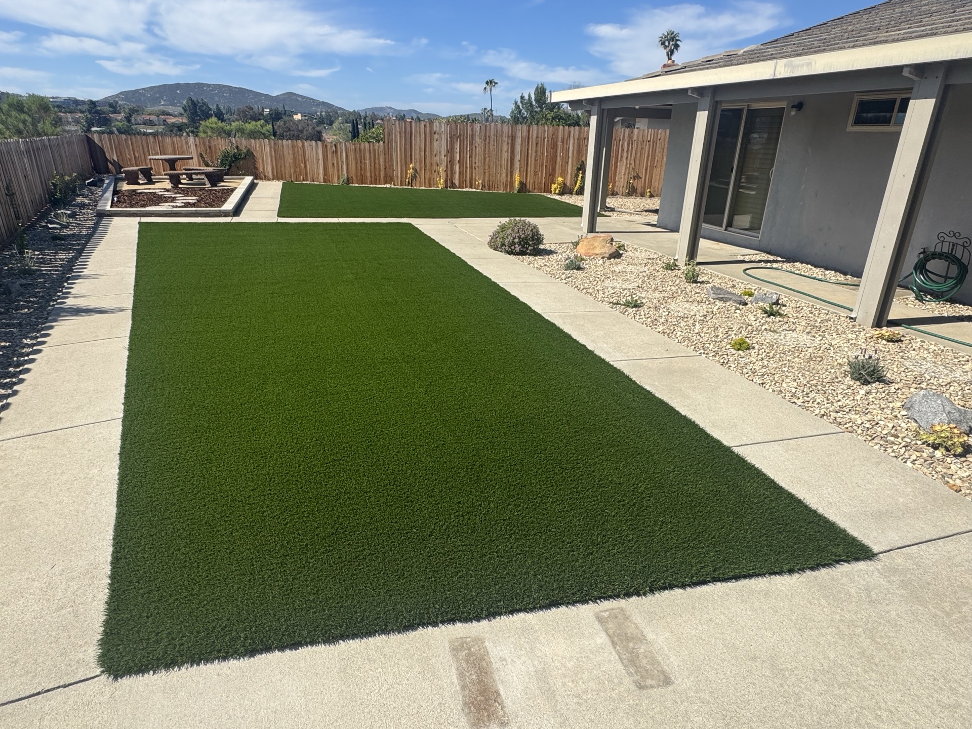 Artificial turf backyard with panoramic mountain views in San Diego