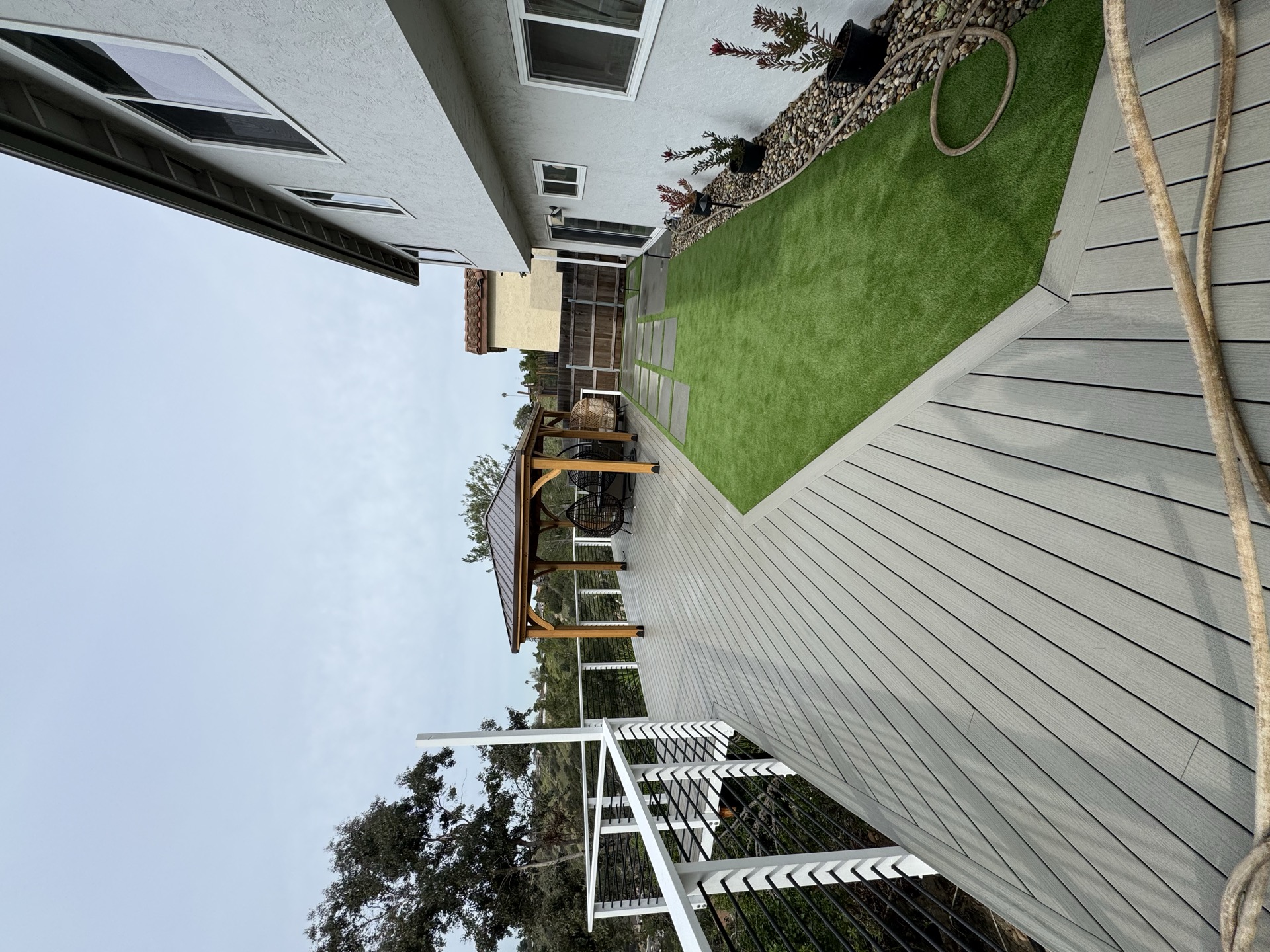 Artificial turf sideyard with custom pergola